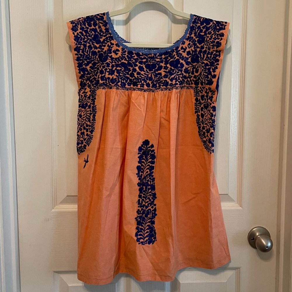 Mi Golondrina Flores short dress in light orange with navy blue embroidery